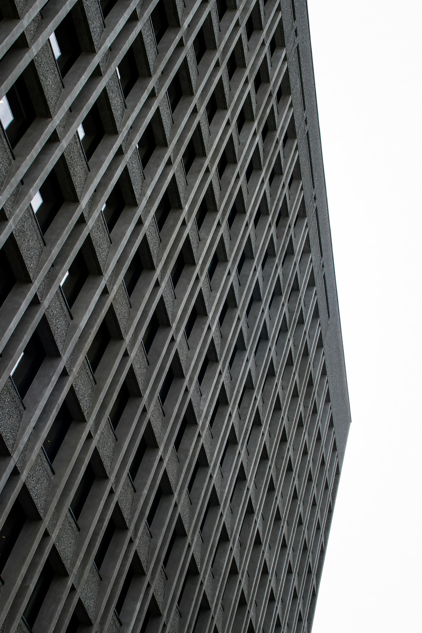 Repeating concrete facade details viewed from below; illustrative architecture